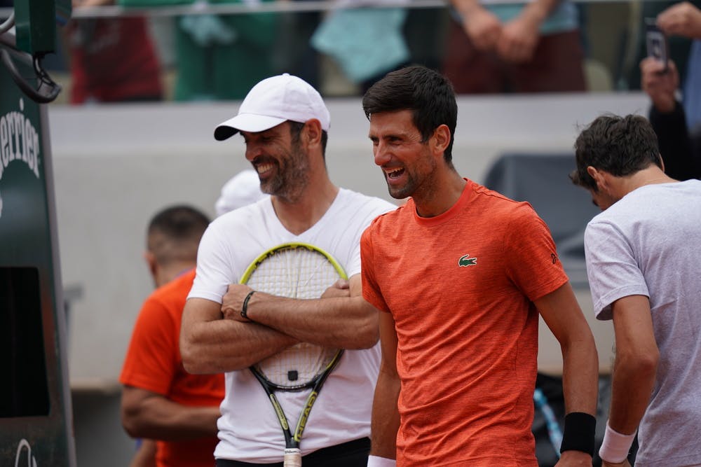 Cedric Pioline and Novak Djokovic share a laugh on Kids Day.