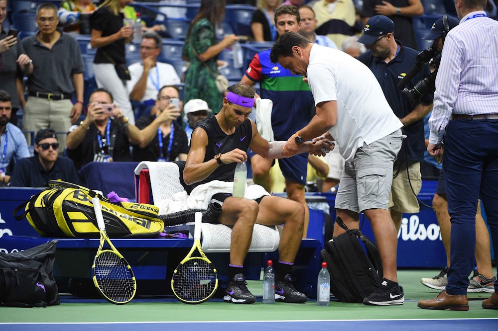 Rafael Nadal getting on court treatment during his quarterfinal at the 2019 US Open