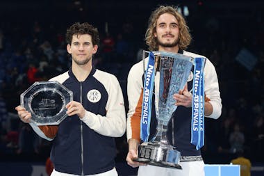 Stefanos Tsitsipas and Dominic Thiem posing with their trophies at the ATP Finals 2019