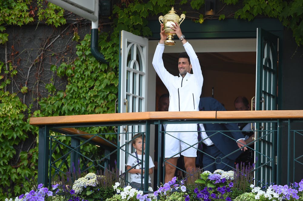 Novak Djokovic presenting the Wimbledon 2019 trophy to the crowd