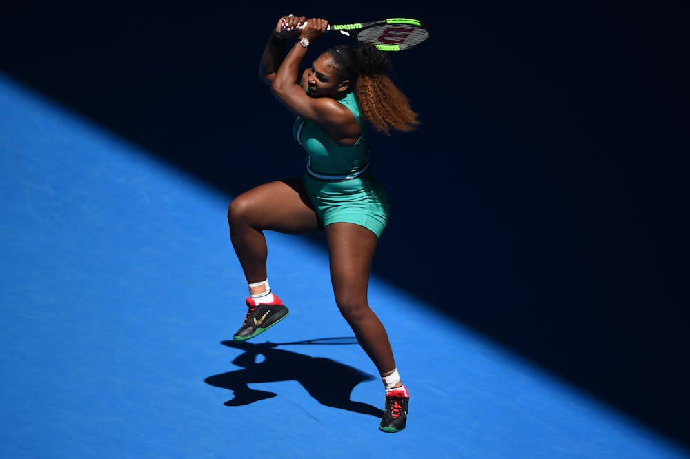 Serena Williams hitting a backhand in the beautiful shadow at the Australian Open 2019