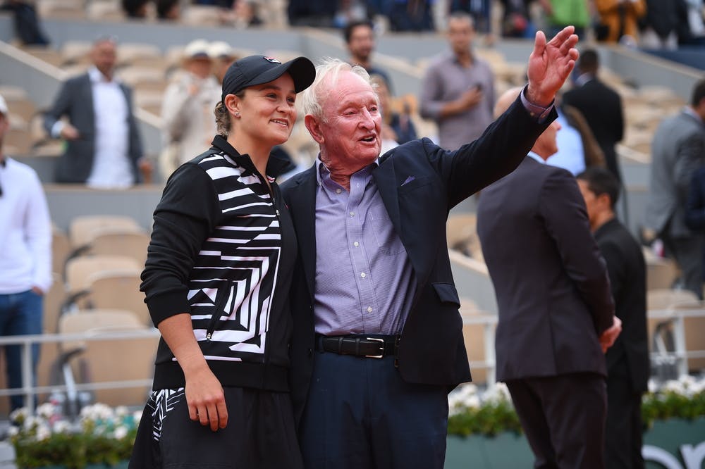 Ashleigh Barty smiling and chatting with Rod Laver at Roland-Garros 2019