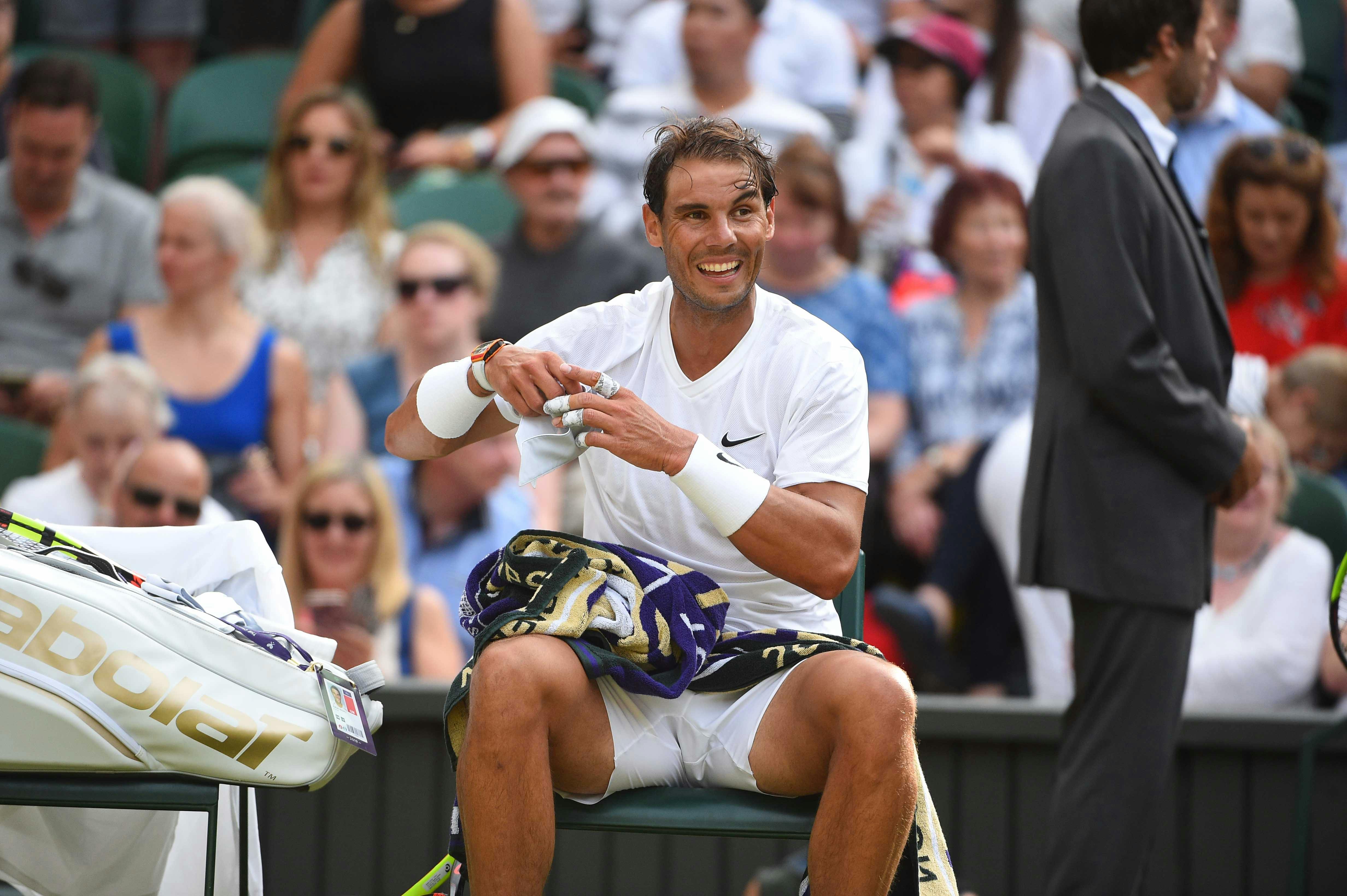 Rafael Nadal smiling during his match against Nick Kyrgios at Wimbledon 2019