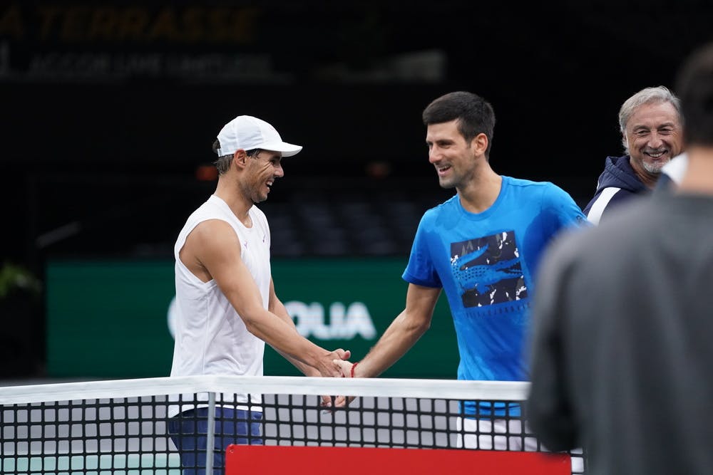 Rafael Nadal and Novak Djokovic joking at practice during the Rolex Paris Masters 2019