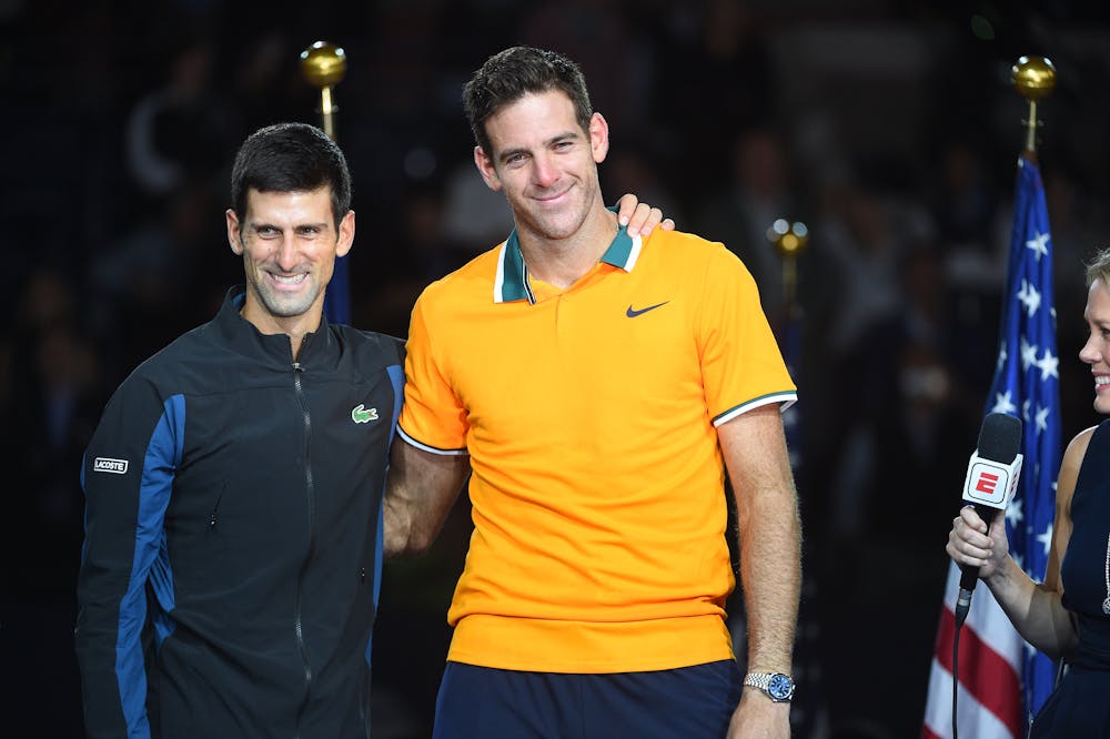 Novak Djokovic and Juan Martin del potro smiling on the podium during trophy presentation US Open 2018