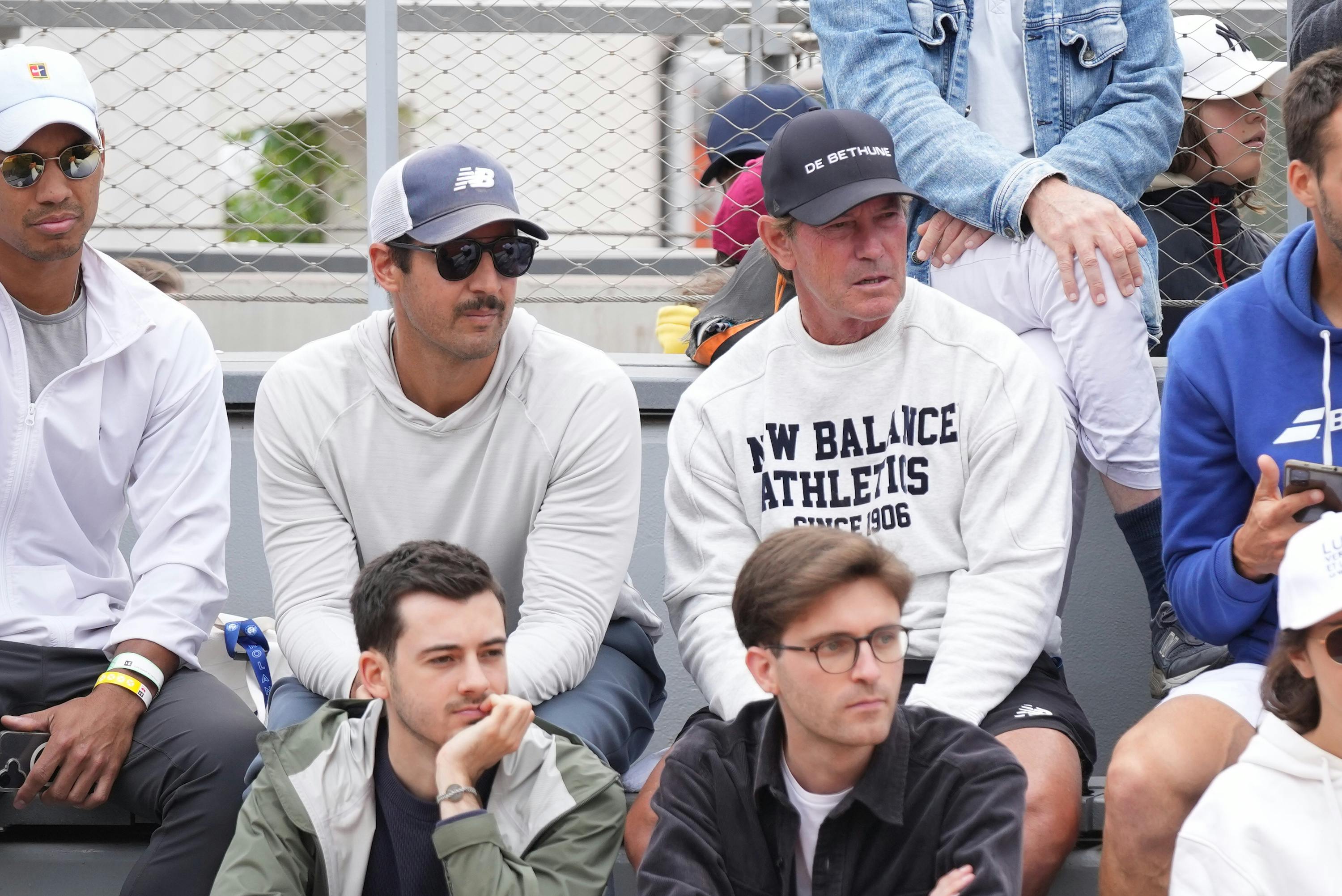 Brian Garber and Brad Stine watch Ethan Quinn during Roland-Garros 2025