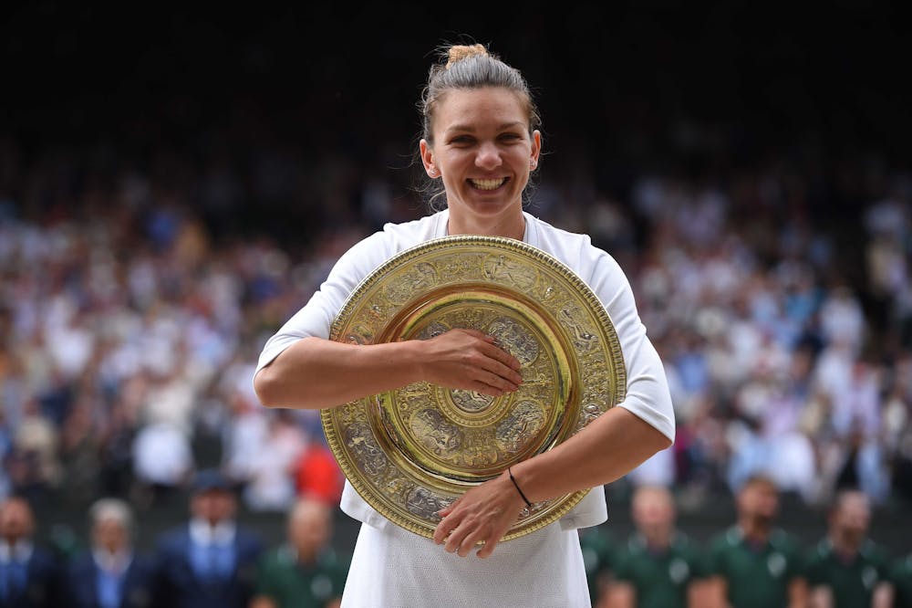 Simona Halep smiling with her Wimbledon 2019 trophy