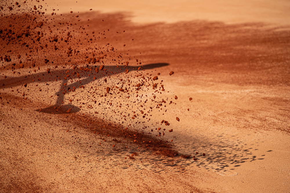 A shadow on the red clay