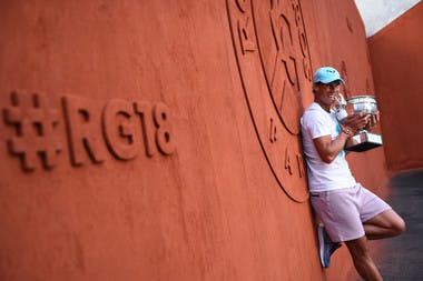 Rafael Nadal against the RG18 wall with his trophy Coupe des Mousquetaires Roland-Garros 2018