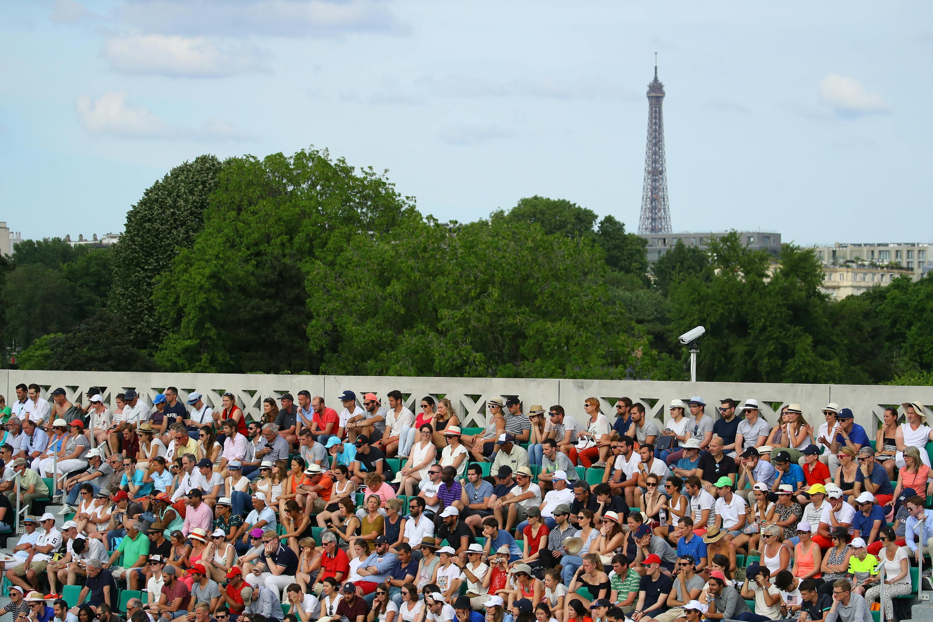 The Eiffel Tower pieces the skyline as crowds watch on during Kids Day.