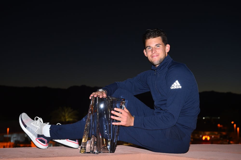 Dominic Thiem posing with his trophy in the night at Indian Wells 2019