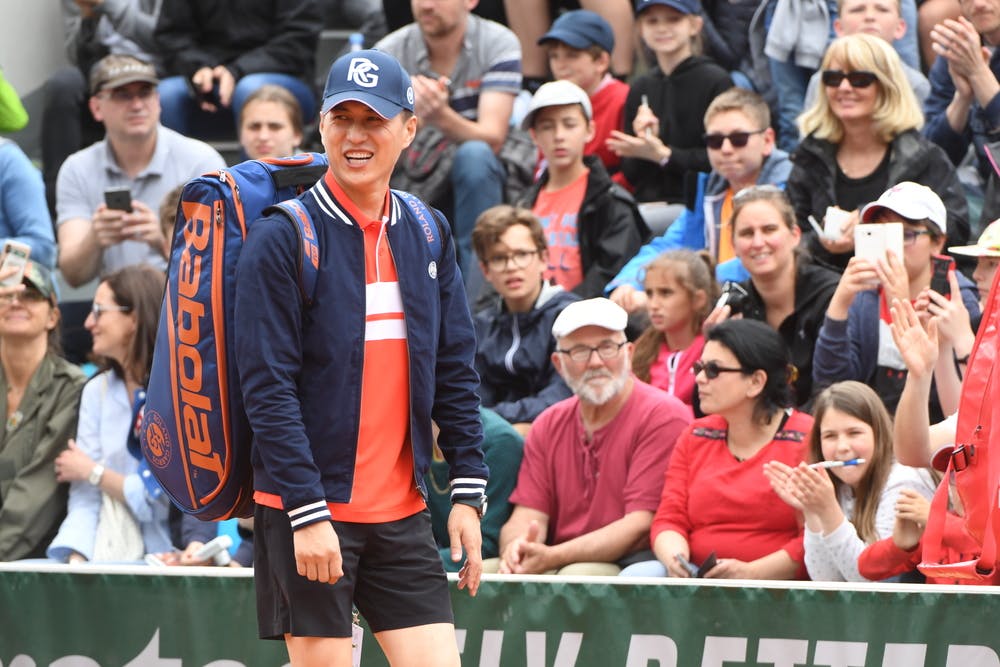 Jin Dong smiling at Roland-Garros 2019