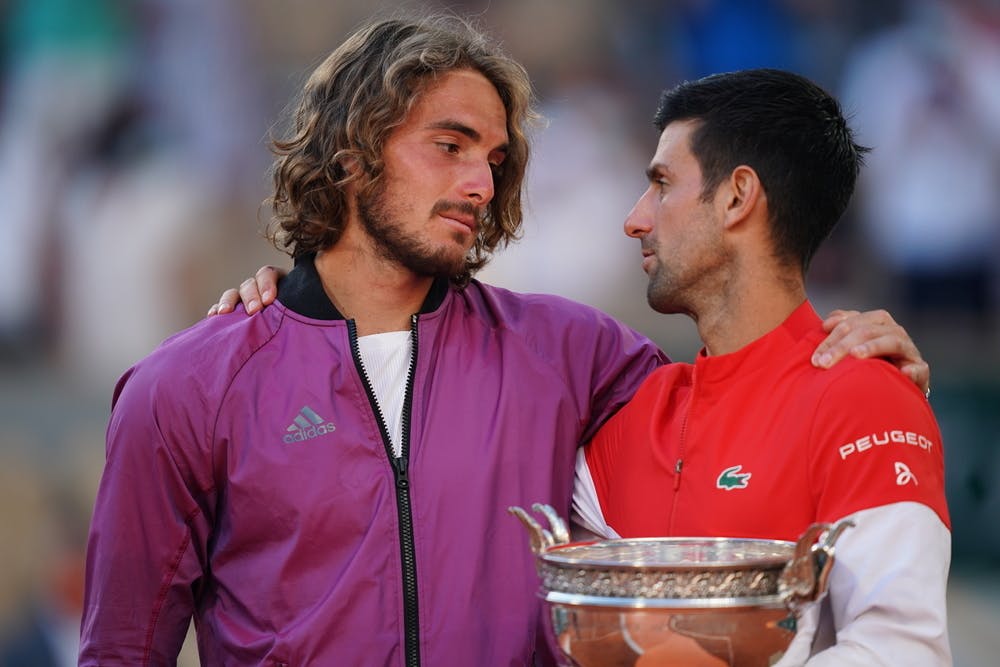 Stefanos Tsitsipas and Novak Djokovic chatting during the trophy presentation at Roland-Garros 2021