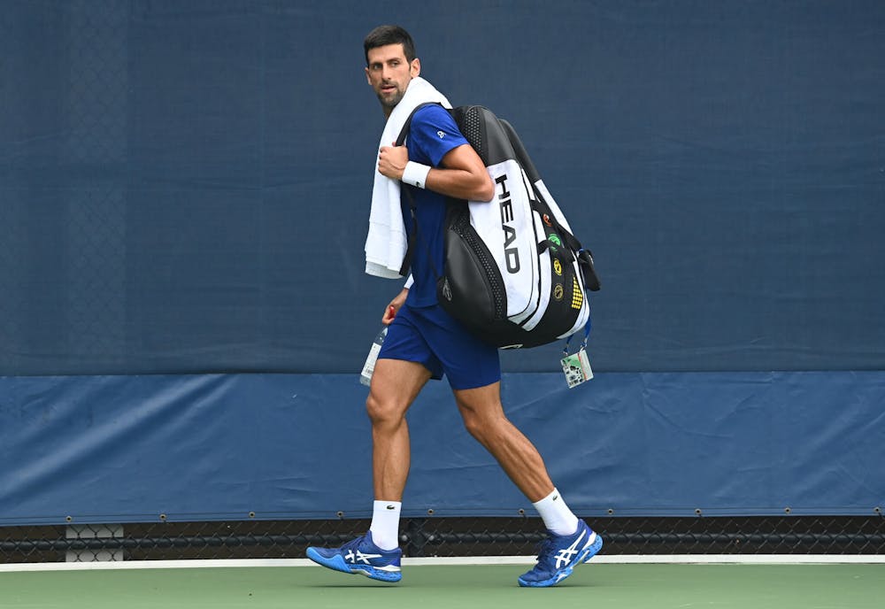 Novak Djokovic exiting a practice court at the 2021 US Open