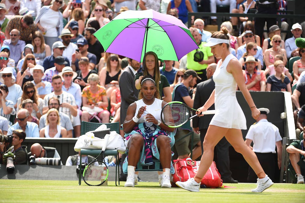 Serena Williams and Simona Halep during a changeover at Wimbledon 2019