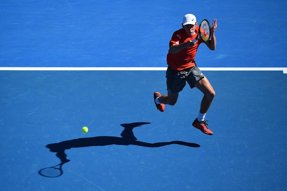 Alex de Minaur jumping during his second round match at the 2019 Australian Open