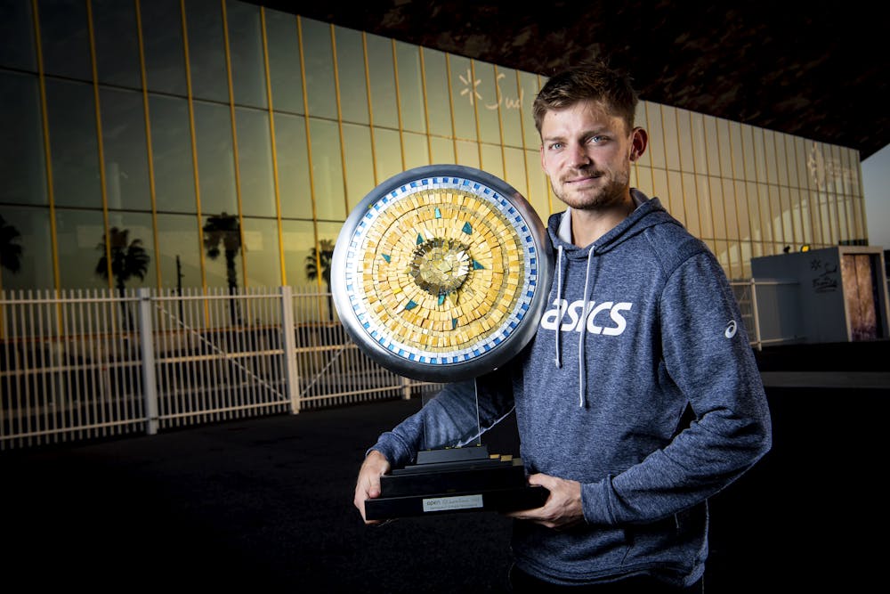 David Goffin posing with his trophy outside the Sud de France Arena Montpellier 2021
