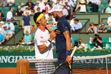 Kei Nishikori (L) and Benoit Paire