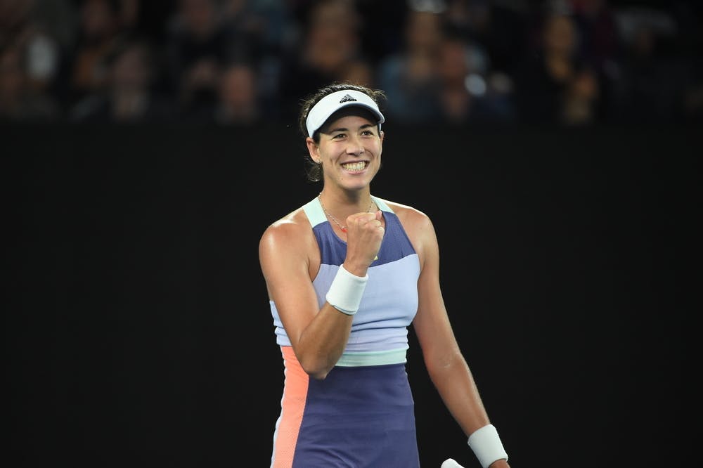 Garbiñe Muguruza smiling and fist pumping during 2020 Australian Open.