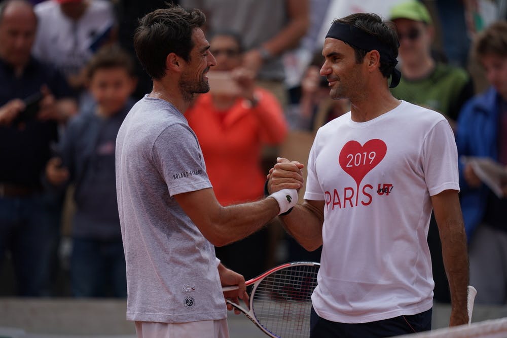 Jeremy Chardy and Roger Federer after a practice session on Kids Day.