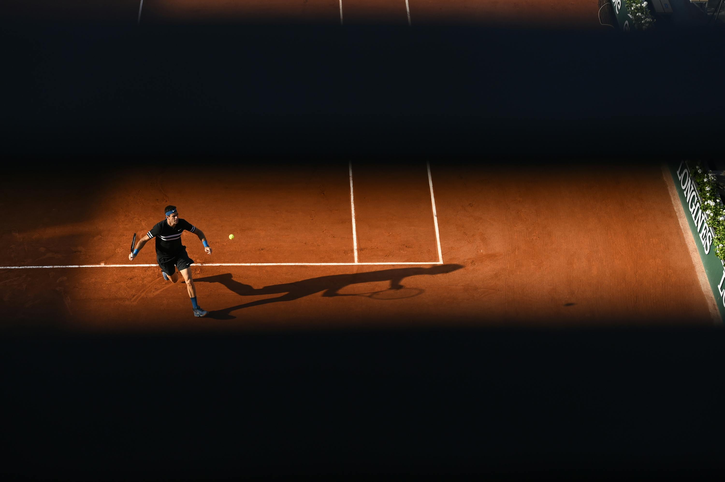 Juan Martin del Potro in light and shadow during Roland-Garros 2018