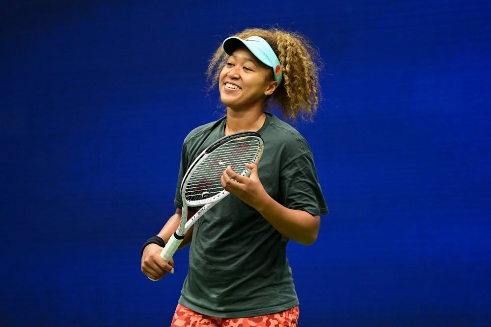 Naomi Osaka smiling during practice at the 2021 US Open