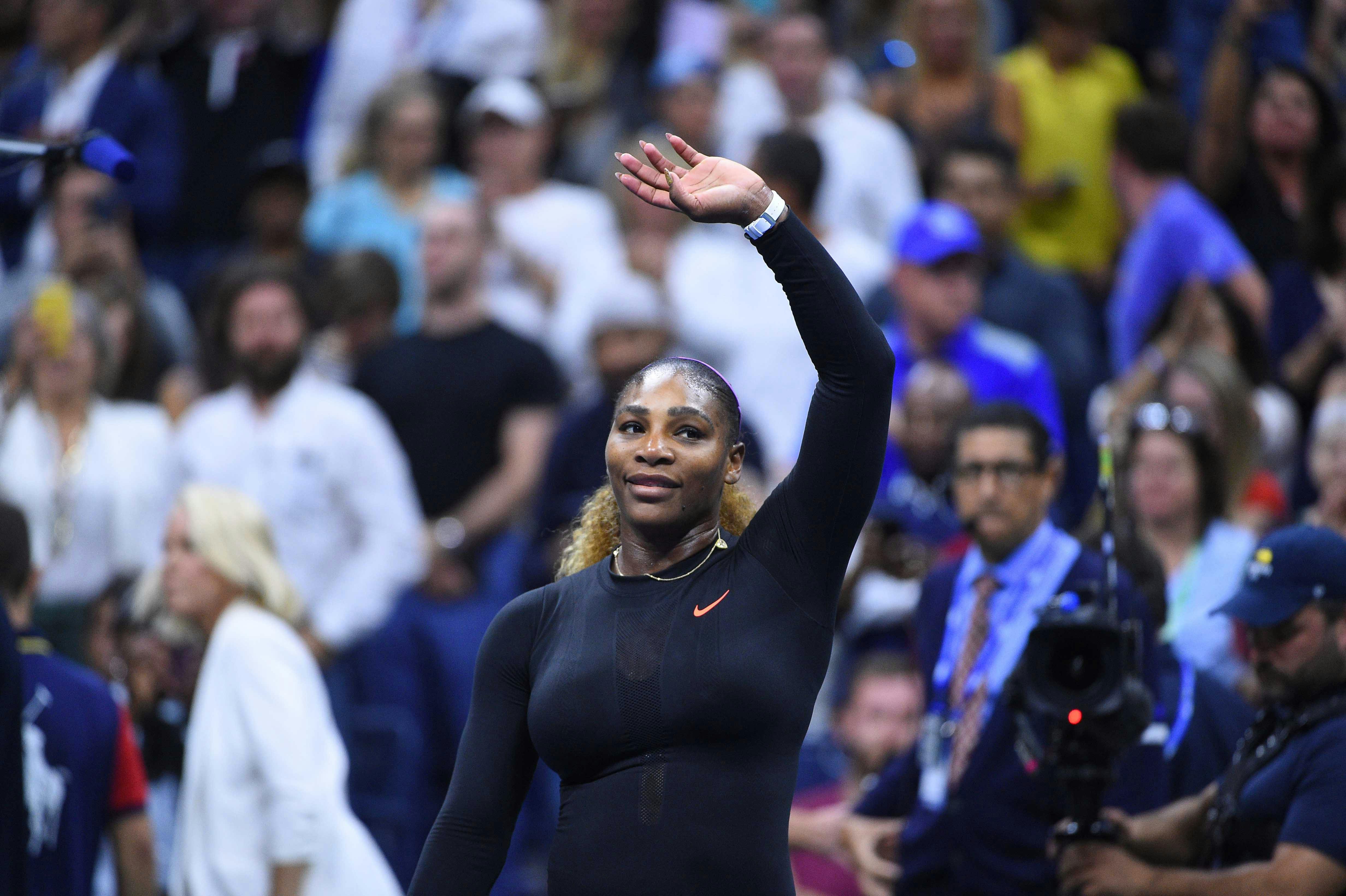 Serena Williams waving to the crowd after her win against Maria Sharapova at the US Open 2019