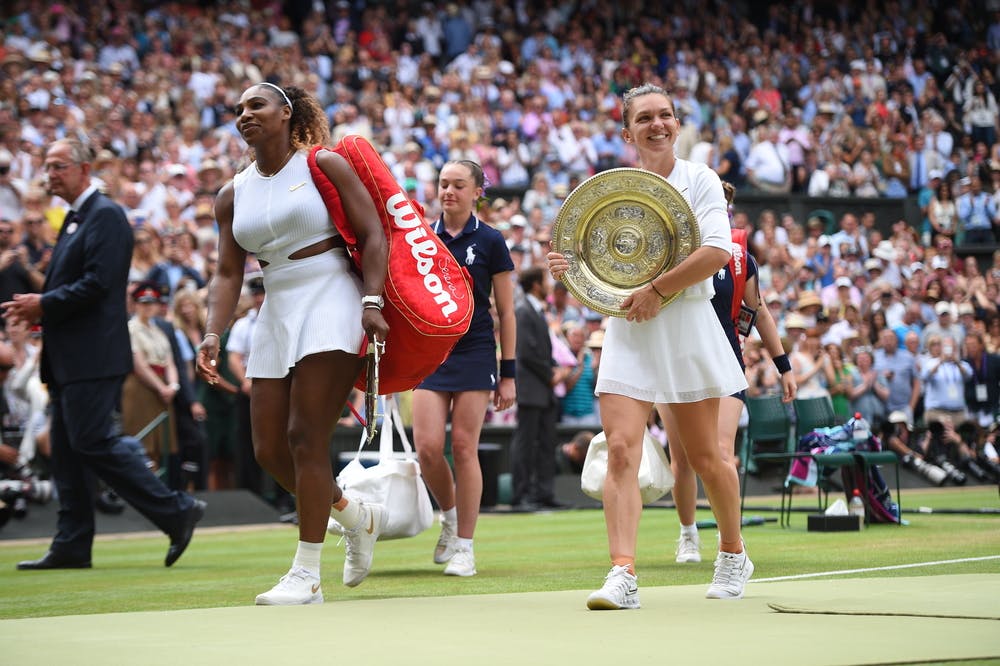 Serena Williams and Simona Halep smiling while exiting Centre Court at Wimbledon 2019