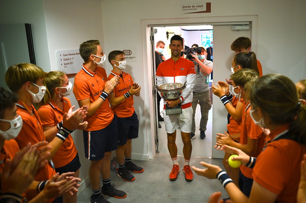 Novak Djokovic in the locker room with ballkids right after his win at Roland-Garros 2021