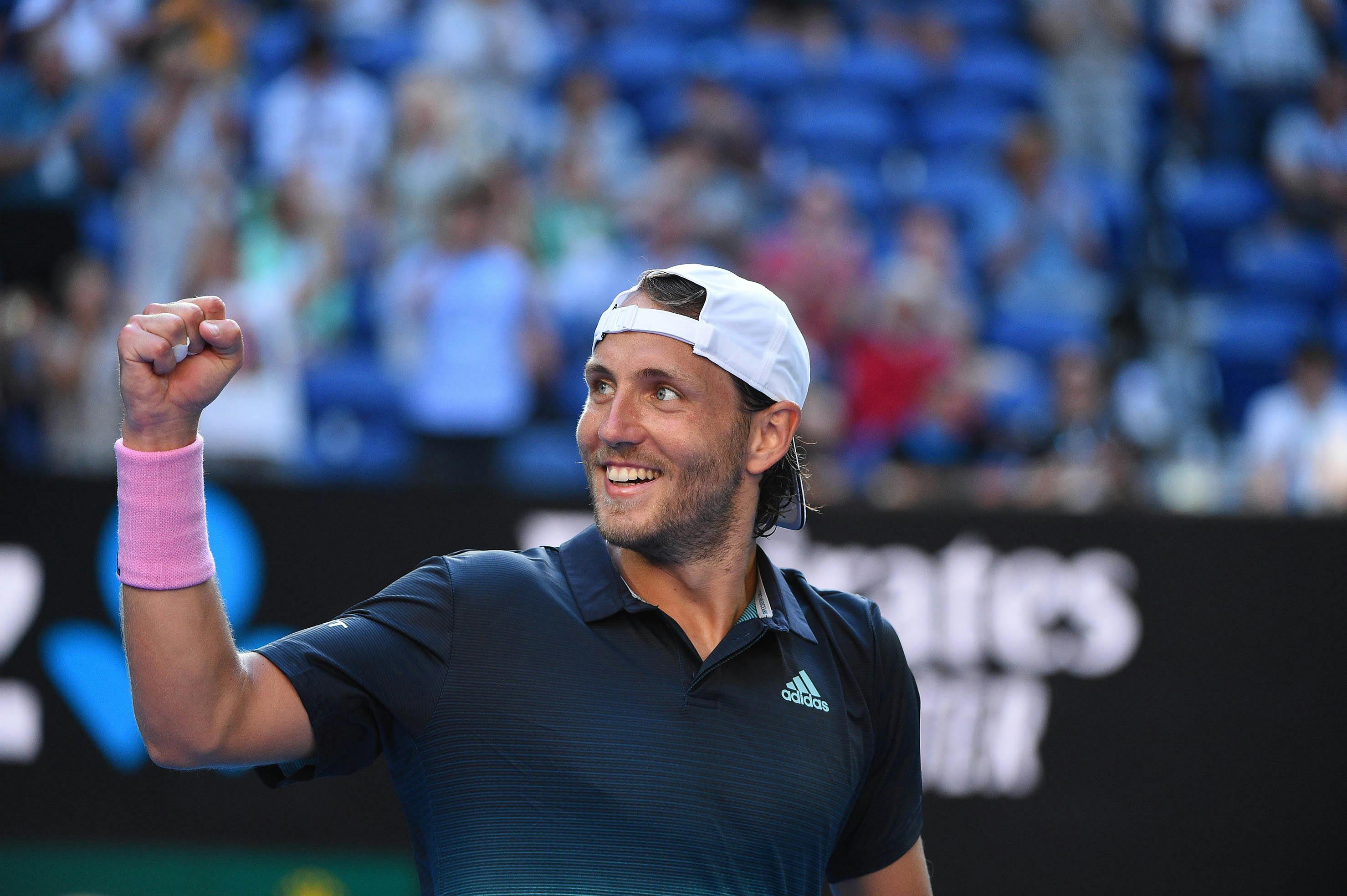 Lucas Pouille smiling and fistpumping after his victory in the quarters of the 2019 Australian Open