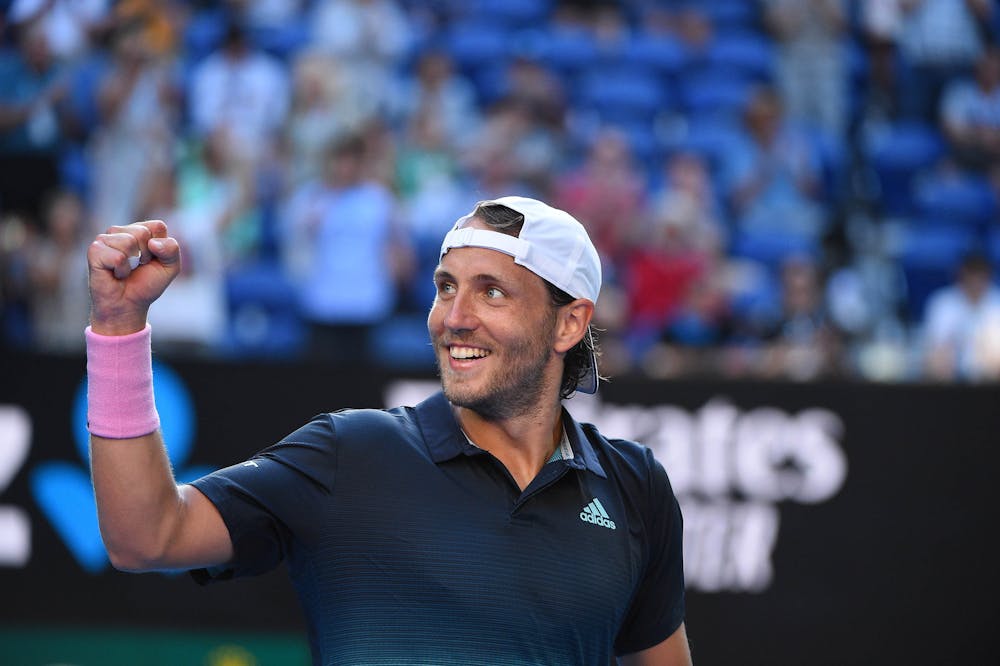 Lucas Pouille smiling and fistpumping after his victory in the quarters of the 2019 Australian Open