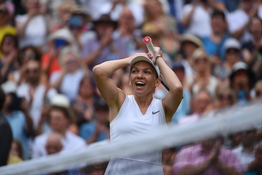 Simona Halep smiling of joy while realizing she just won Wimbledon 2019
