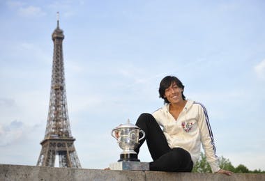2010 Roland-Garros women's singles champion Francesca Schiavone poses with the Coupe Suzanne-Lenglen in front of the Tour Eiffel