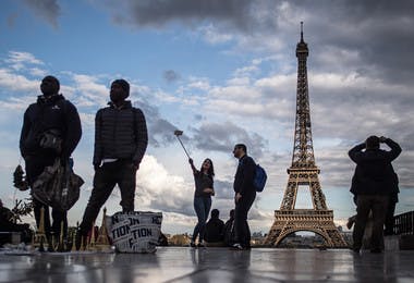 Tourists at the Eiffel Tower in Paris.