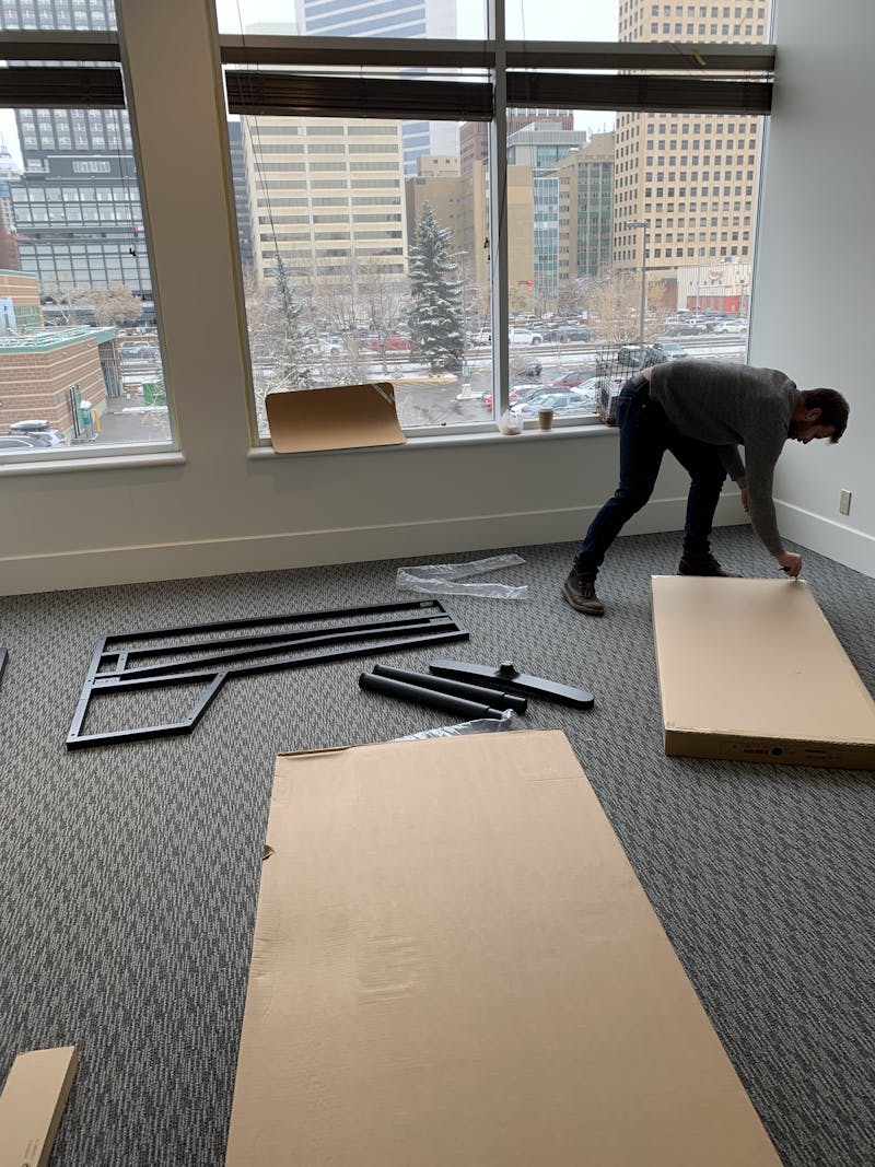 Brett opening some boxes in our new office