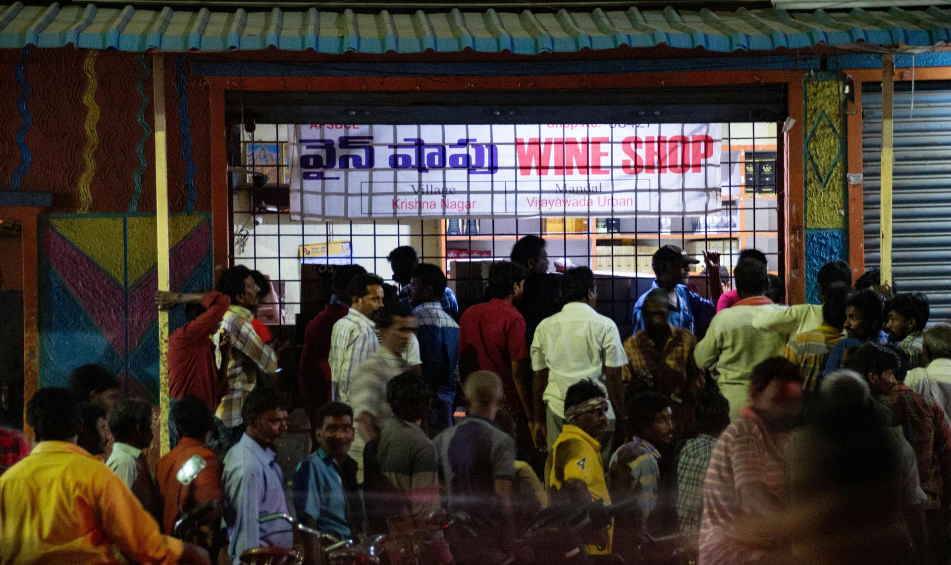 The remaining wine shops in Vijayawada draw jostling crowds every night. Photo by Justin Nisly.