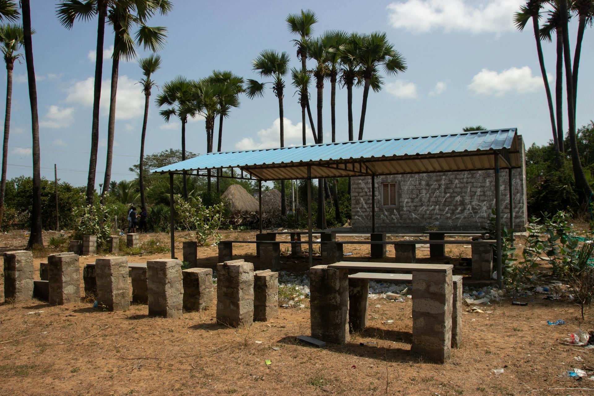 Abandoned benches and bottles mark the site of a shuttered liquor store in Kappaladoddi. Photo by Justin Nisly.