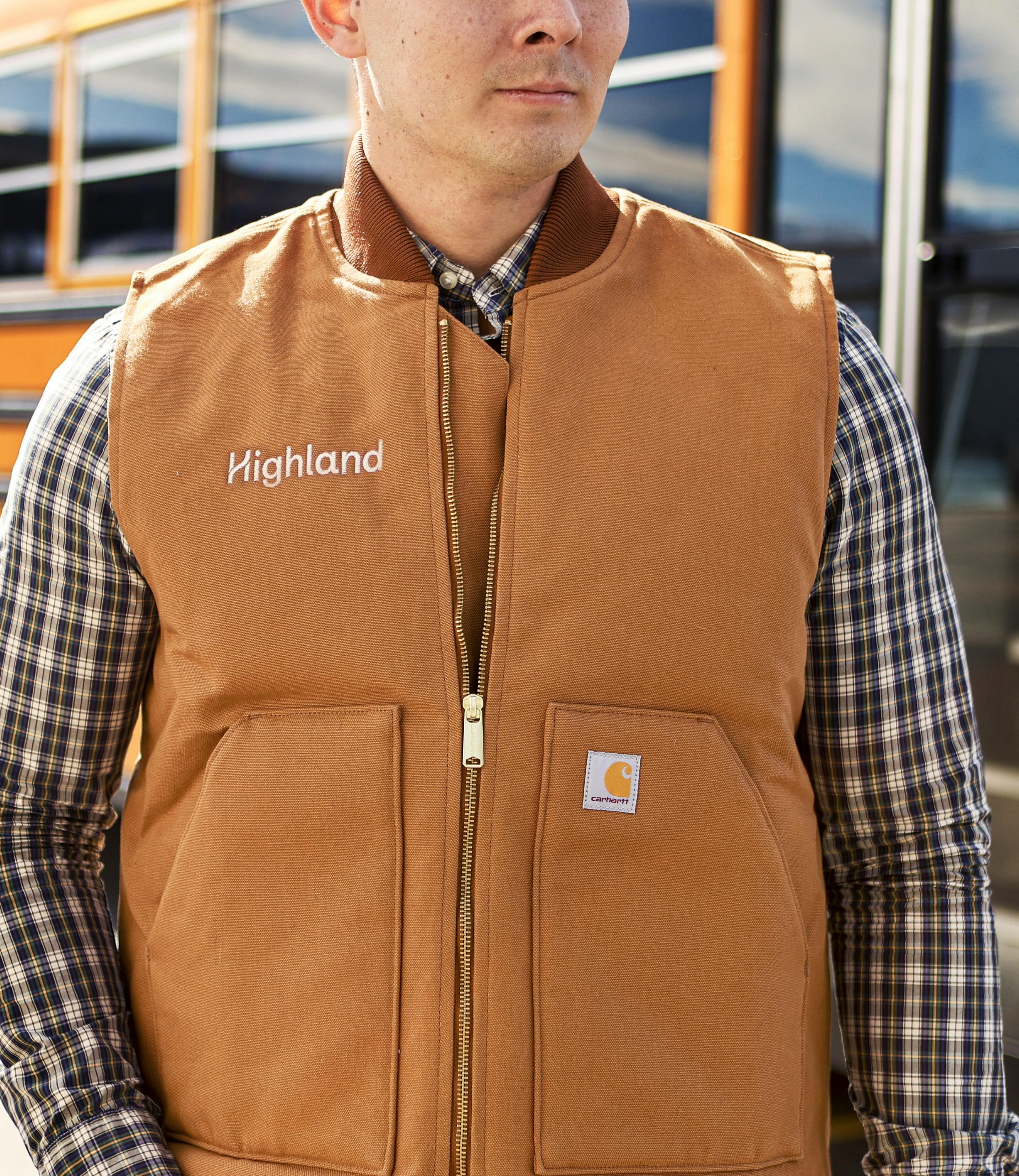 The Highland logo embroidered on a Carhartt vest.