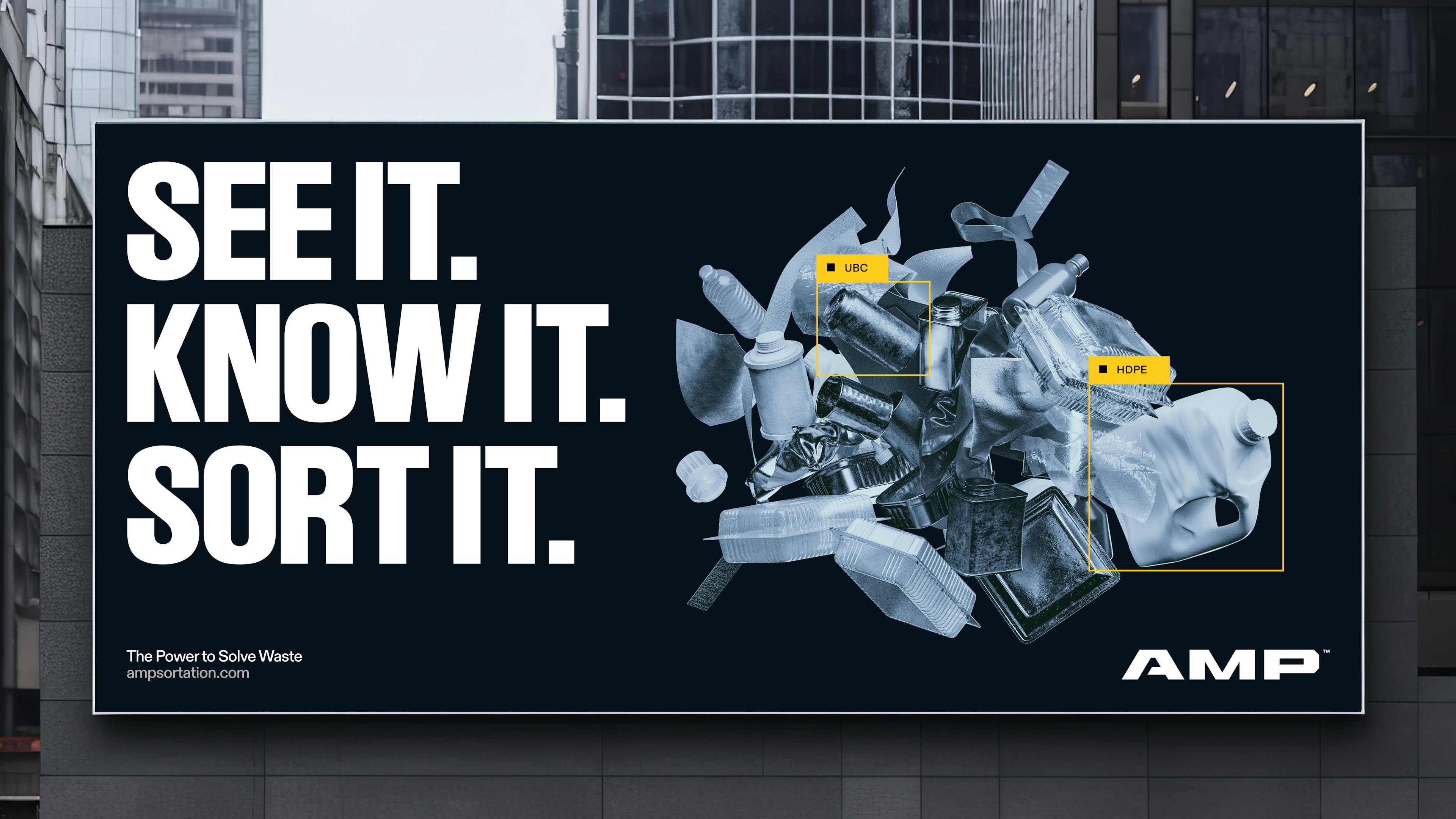 An advertisement for AMP on a billboard with the message, "See it, know it, sort it."