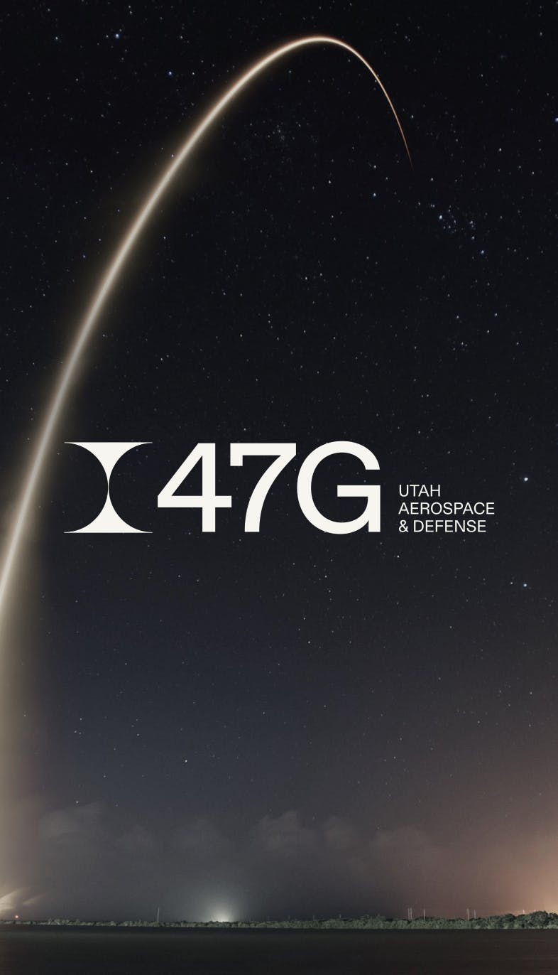 The 47G Logo on top of a night sky.