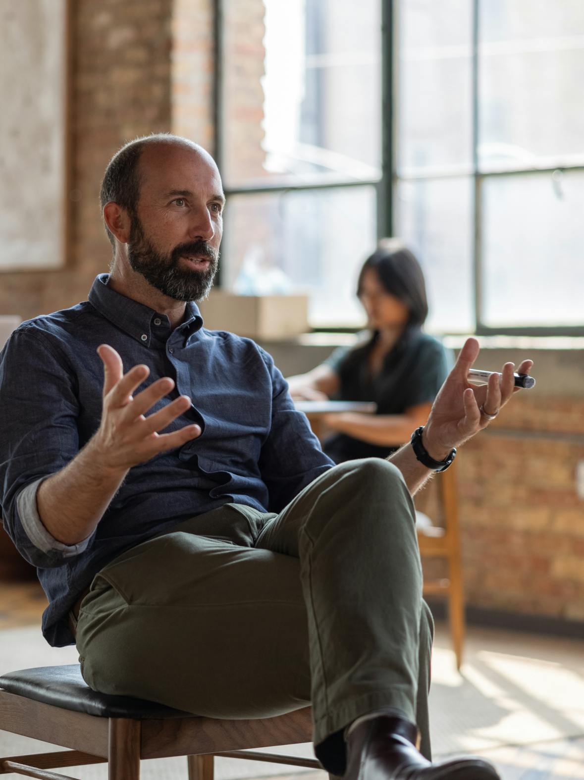 Figure Founder talks in a group discussion in a Figure workshop.