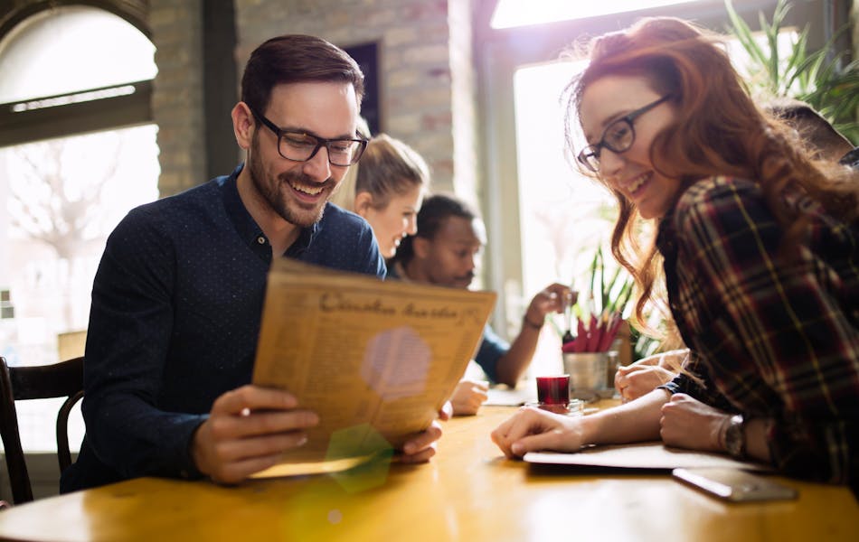 Colleagues socialising in restaurant