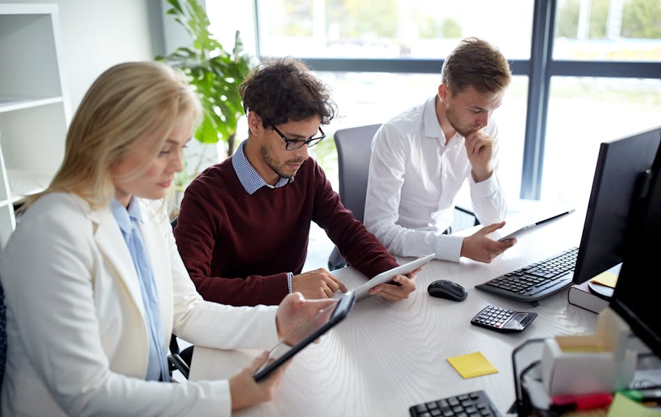 Three people in business meeting