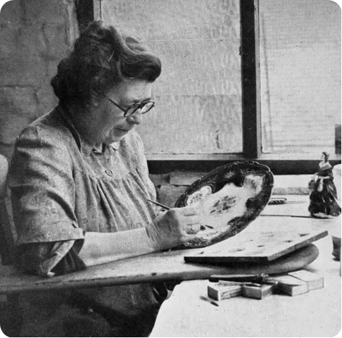 Violet Moreton painting china by hand