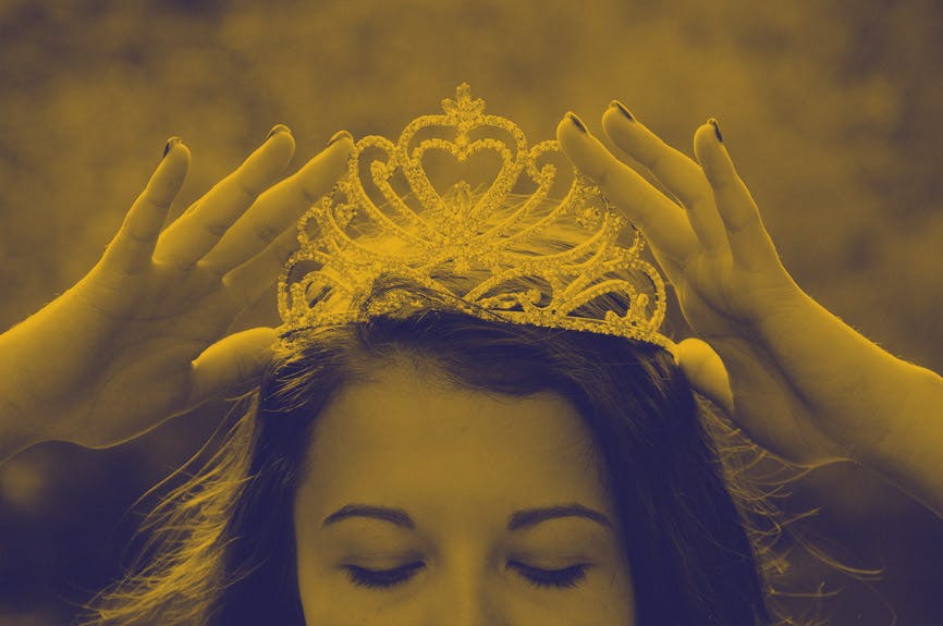 A royal tiara on a woman's head