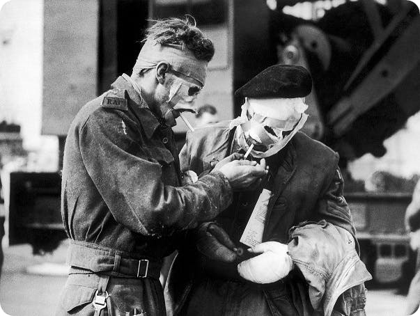 Injured soldiers smoking in Normandy, D-Day, 1944.