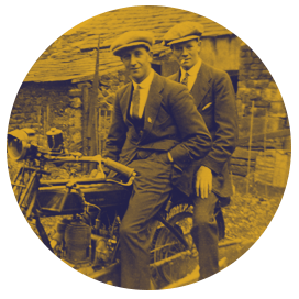 Vintage photo of two men on a bicycle