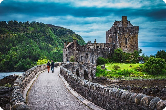 Tourists exploring a castle in the UK