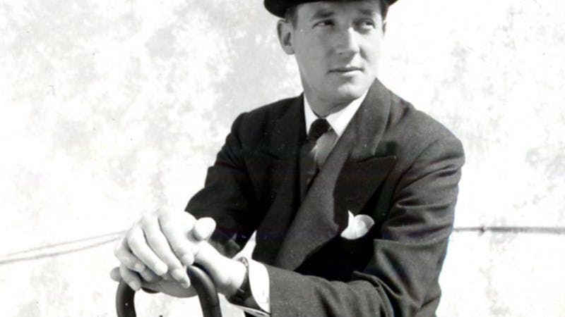 Back and white photo of fashion designer Hardy Amies in a bowler hat.