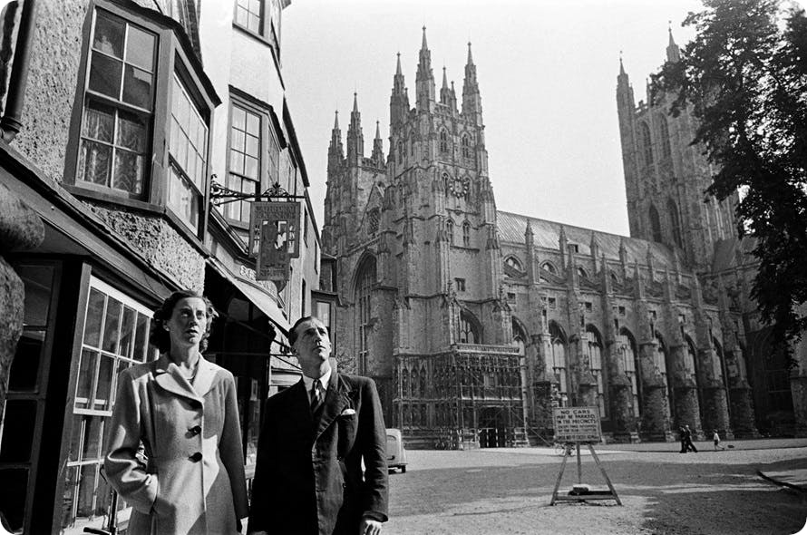 An old photo of people in front of Canterbury Cathedral